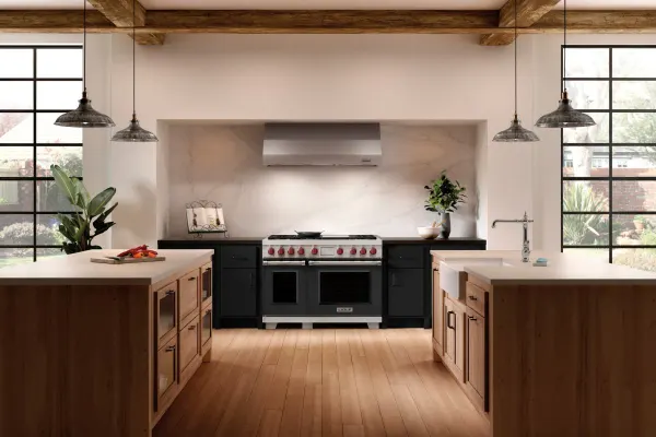 Wolf 48-inch dual fuel range installed in a dark kitchen.